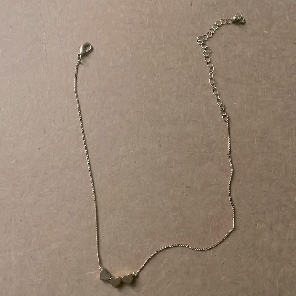 Golden necklace with hearts